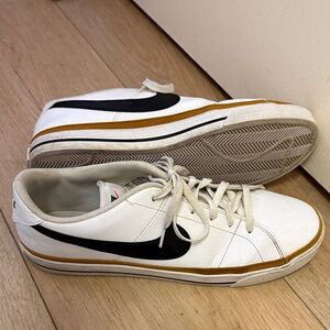 Nike Men's White and Black Sneakers with Gold Accents